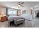 Spacious bedroom with ceiling fan and en-suite bathroom at 5432 E Grandview Rd, Scottsdale, AZ 85254