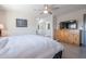 Main bedroom with wood dresser and en-suite bathroom at 5432 E Grandview Rd, Scottsdale, AZ 85254