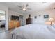 Bedroom with wood dresser and ceiling fan at 5432 E Grandview Rd, Scottsdale, AZ 85254