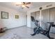 Spacious bedroom with Peloton bike and double doors at 5432 E Grandview Rd, Scottsdale, AZ 85254