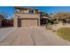 Two-story house with a two-car garage and nicely landscaped front yard at 5432 E Grandview Rd, Scottsdale, AZ 85254