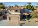 Two story house with tile roof and attached garage at 5432 E Grandview Rd, Scottsdale, AZ 85254