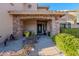 Inviting front entrance with stone pillars and colorful flowers at 5432 E Grandview Rd, Scottsdale, AZ 85254