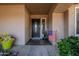 Front entrance with a dark wooden door and American flag at 5432 E Grandview Rd, Scottsdale, AZ 85254