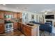 Modern kitchen with stainless steel appliances and granite island at 5432 E Grandview Rd, Scottsdale, AZ 85254