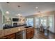 Kitchen with granite countertops, stainless steel appliances & pool view at 5432 E Grandview Rd, Scottsdale, AZ 85254