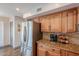 Kitchen with stainless steel refrigerator and wood cabinets at 5432 E Grandview Rd, Scottsdale, AZ 85254