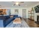 Living area with sectional sofa and built-in shelving at 5432 E Grandview Rd, Scottsdale, AZ 85254