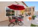 Outdoor patio furniture under a red umbrella at 5432 E Grandview Rd, Scottsdale, AZ 85254