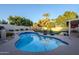 Inviting kidney-shaped pool with surrounding patio at 5432 E Grandview Rd, Scottsdale, AZ 85254