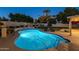 Inviting swimming pool with surrounding patio and landscaping at 5432 E Grandview Rd, Scottsdale, AZ 85254