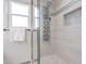 Updated shower with a multi-function shower head and tile surround at 5432 E Grandview Rd, Scottsdale, AZ 85254