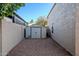 Small metal storage shed in the backyard at 5432 E Grandview Rd, Scottsdale, AZ 85254