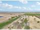 Aerial view showing a house on a large lot with farmland nearby at 5819 S 102Nd Dr, Tolleson, AZ 85353