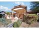 Front view of a single-story home with a covered porch and landscaped yard at 5819 S 102Nd Dr, Tolleson, AZ 85353