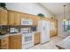 Well-equipped kitchen with ample counter space and wood cabinets at 5819 S 102Nd Dr, Tolleson, AZ 85353