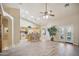 Kitchen features island with seating and light wood cabinets at 5819 S 102Nd Dr, Tolleson, AZ 85353