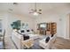 Living room with comfy seating, wood floors, and a fireplace at 5819 S 102Nd Dr, Tolleson, AZ 85353