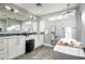 Elegant bathroom with double sinks, soaking tub, and a separate shower at 6102 E Nisbet Rd, Scottsdale, AZ 85254