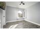 Spacious bedroom with an arched window and ceiling fan at 6102 E Nisbet Rd, Scottsdale, AZ 85254