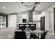 Modern kitchen featuring a large island and white cabinets at 6102 E Nisbet Rd, Scottsdale, AZ 85254