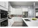 Modern kitchen with stainless steel appliances and white cabinetry at 6102 E Nisbet Rd, Scottsdale, AZ 85254