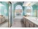 Double vanity bathroom with a bathtub and large windows at 6439 E Redmont Dr, Mesa, AZ 85215