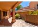 Covered patio with tile flooring and lush landscaping at 6439 E Redmont Dr, Mesa, AZ 85215