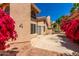 Large patio with tile flooring and bougainvillea at 6439 E Redmont Dr, Mesa, AZ 85215