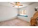 Cozy bedroom with window seat and ceiling fan at 6751 N 77Th Dr, Glendale, AZ 85303