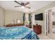 Comfortable bedroom featuring a ceiling fan and TV at 6810 W Vermont Ave, Glendale, AZ 85303