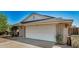 Brick home with a white garage door and desert plants at 6810 W Vermont Ave, Glendale, AZ 85303