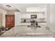 Granite kitchen island with sink and modern cabinetry at 6810 W Vermont Ave, Glendale, AZ 85303