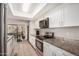 Modern kitchen featuring white cabinets and granite countertops at 6810 W Vermont Ave, Glendale, AZ 85303