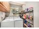 Laundry room with washer, dryer, and storage cabinets at 6810 W Vermont Ave, Glendale, AZ 85303