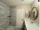 Modern bathroom with shower and tile surround at 7045 W Ocotillo Rd, Glendale, AZ 85303