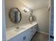 Modern bathroom with double vanity and large mirrors at 7045 W Ocotillo Rd, Glendale, AZ 85303