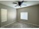 Bright bedroom with neutral walls, ceiling fan, and window blinds at 7045 W Ocotillo Rd, Glendale, AZ 85303