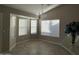 Bright dining area with bay windows and wood-look tile floors at 7045 W Ocotillo Rd, Glendale, AZ 85303