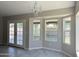 Spacious dining area with large bay windows and a chandelier at 7045 W Ocotillo Rd, Glendale, AZ 85303