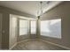 Dining room with bay windows and chandelier at 7045 W Ocotillo Rd, Glendale, AZ 85303