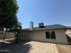 Rear view of house showing patio and landscaping at 7045 W Ocotillo Rd, Glendale, AZ 85303