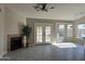 Living room with fireplace, french doors, and bay window at 7045 W Ocotillo Rd, Glendale, AZ 85303