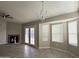 Living room with fireplace, french doors, and bay window at 7045 W Ocotillo Rd, Glendale, AZ 85303