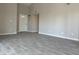 Bright living room featuring gray tile floors and an open floor plan at 7045 W Ocotillo Rd, Glendale, AZ 85303