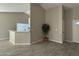 Open concept living area with a view of the kitchen and entryway at 7045 W Ocotillo Rd, Glendale, AZ 85303