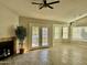 Living room with fireplace, french doors, and bay window at 7045 W Ocotillo Rd, Glendale, AZ 85303