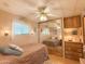 Cozy bedroom with mirrored closet and ceiling fan at 7750 E Broadway Rd # 123, Mesa, AZ 85208