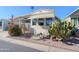 Inviting manufactured home exterior, landscaped yard, and covered carport at 7750 E Broadway Rd # 123, Mesa, AZ 85208