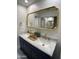 Elegant bathroom with double vanity and marble countertop at 7904 E Pepper Tree Ln, Scottsdale, AZ 85250